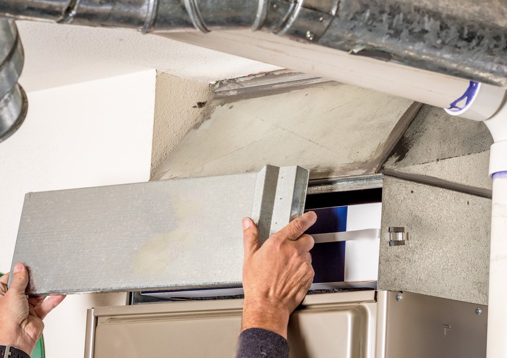 removal of furnace door to access inside of furnace